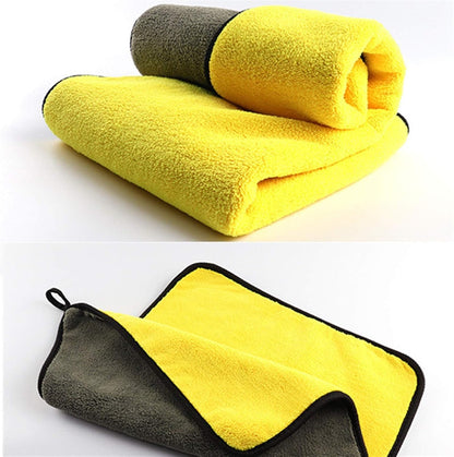 Yellow and gray double-sided microfiber cloths, shown folded and open