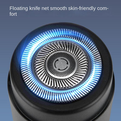 Close-up of the shaver's round foil head with a blue illuminated ring