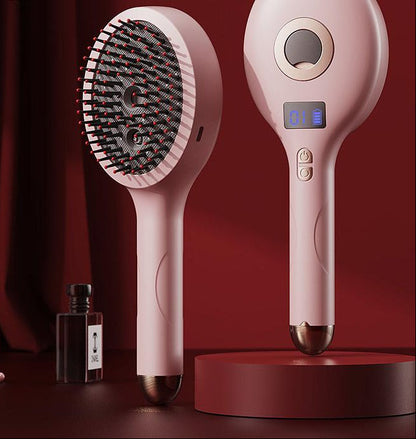 Pink electric massage spray comb with bristles, mist outlet, and digital display