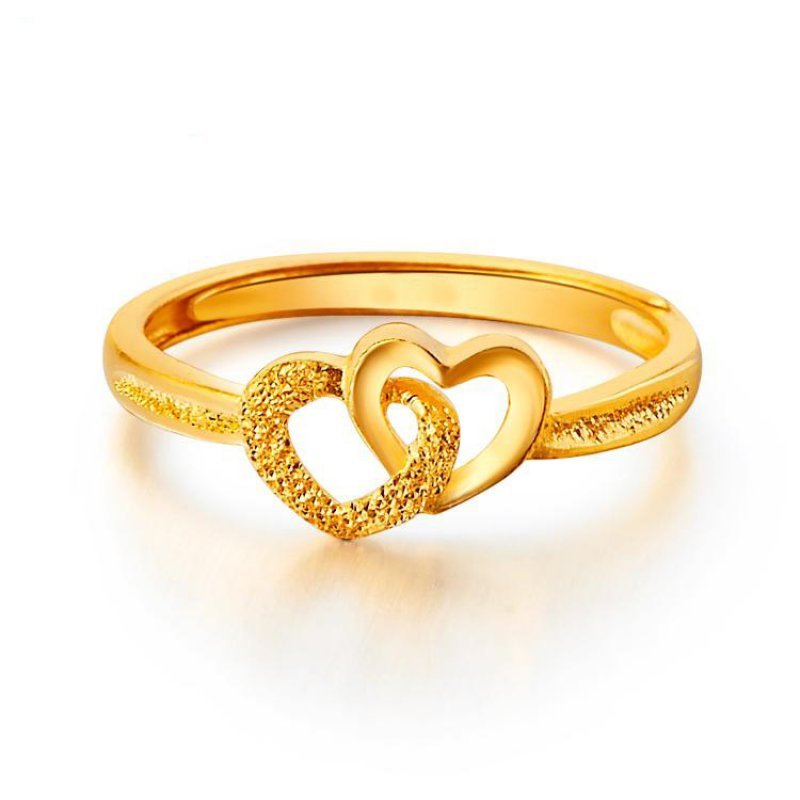 Gold-plated ring with overlapping smooth and textured heart outlines