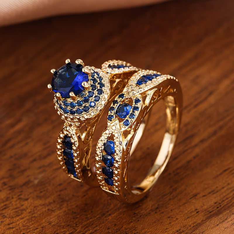 Women's gold ring with blue zircon stones and filigree design