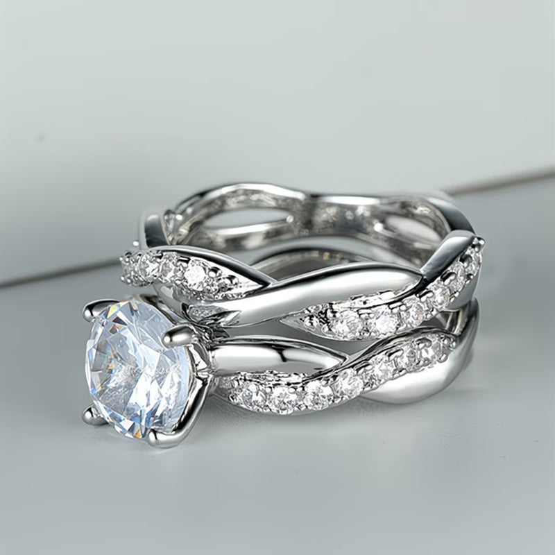 Women's zircon ring with braided silver-tone band and clear round stone